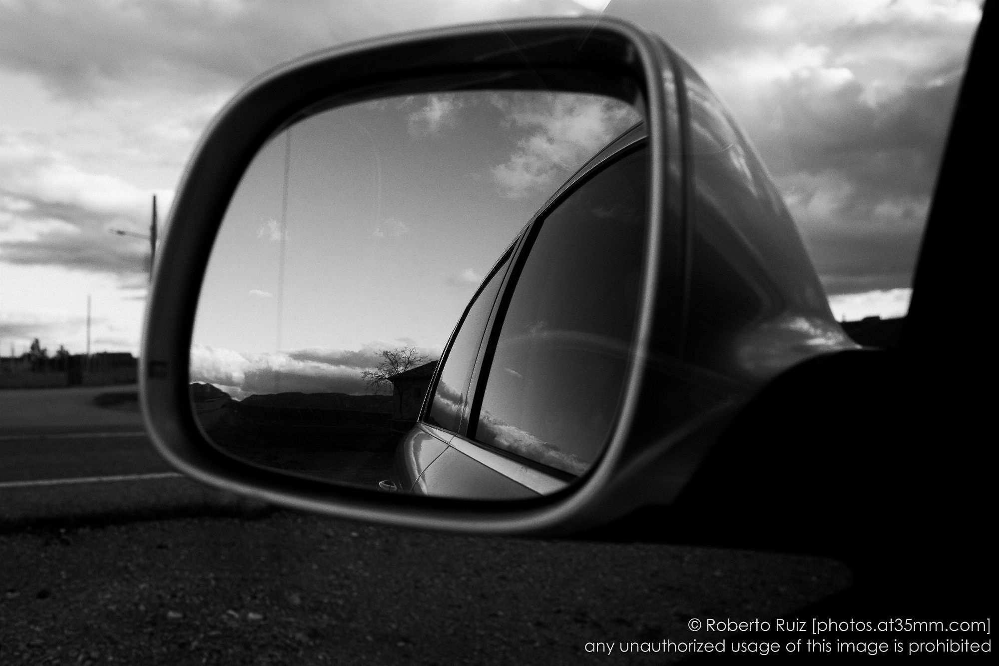 objects in the rear view mirror may appear closer than they are